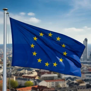 علم الاتحاد الأوروبي يرفرف فوق مدينة أوروبية، مما يعكس جمال وثقافة دول الاتحاد التي توفر فرص دراسة بتكاليف منخفضة للطلاب الدوليين. أرخص 10 دول للدراسة.